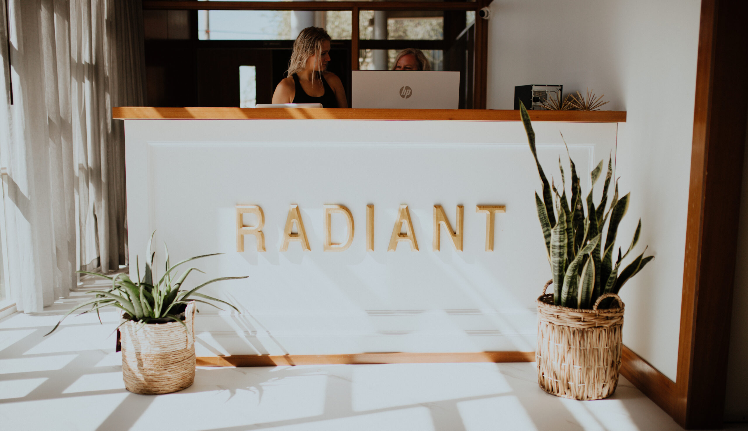 Radiant front desk Reflection in the mirror. Woman looks in the mirror noticing the first wrinkles